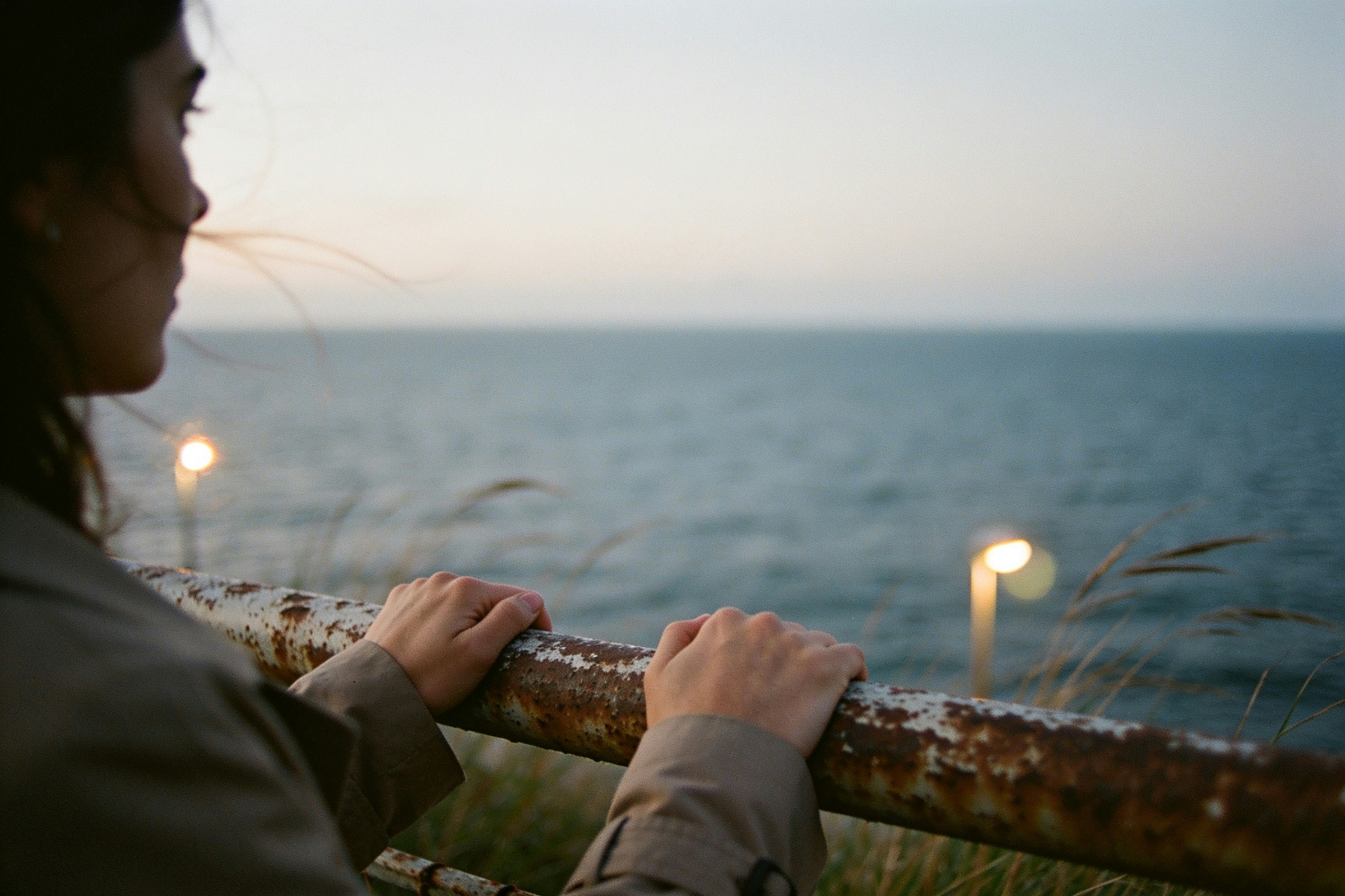 Twilight ocean from a rusted sea wall